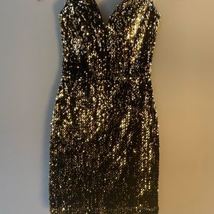 Sparkle this New Years in this fun and festive strapless mini!